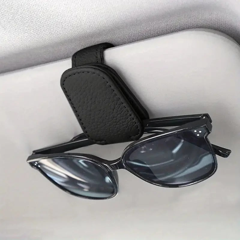 Clip magnético para óculos para colocar na viseira do automóvel, feito de couro sintético e prático